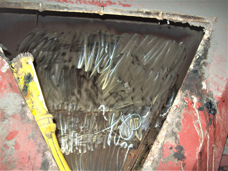 Here is a view through the access panel to a coal chute, after cleaning and surface preparation by diamond grinding.